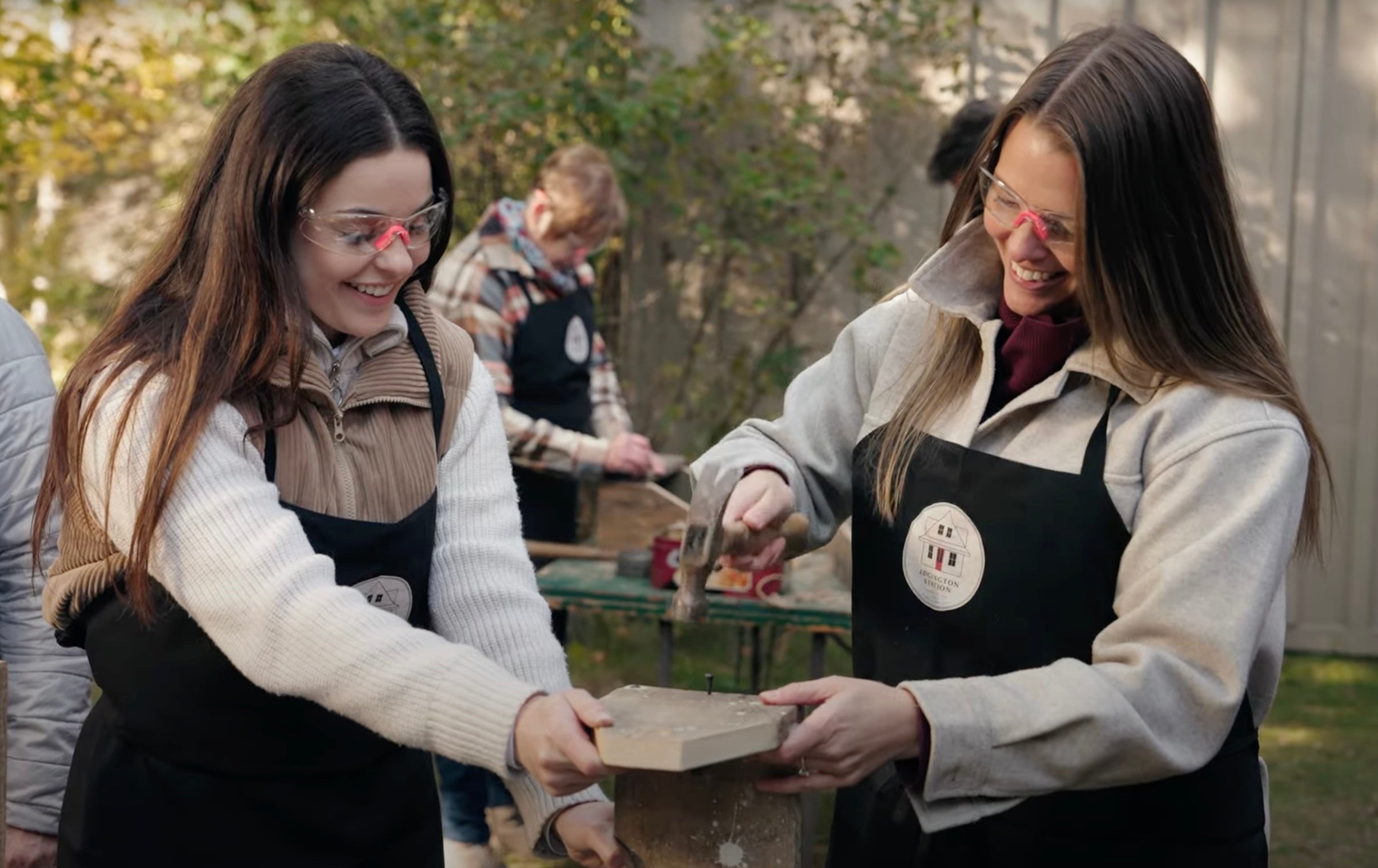 Load video: A small group is outside making toolboxes from up-cycled wood