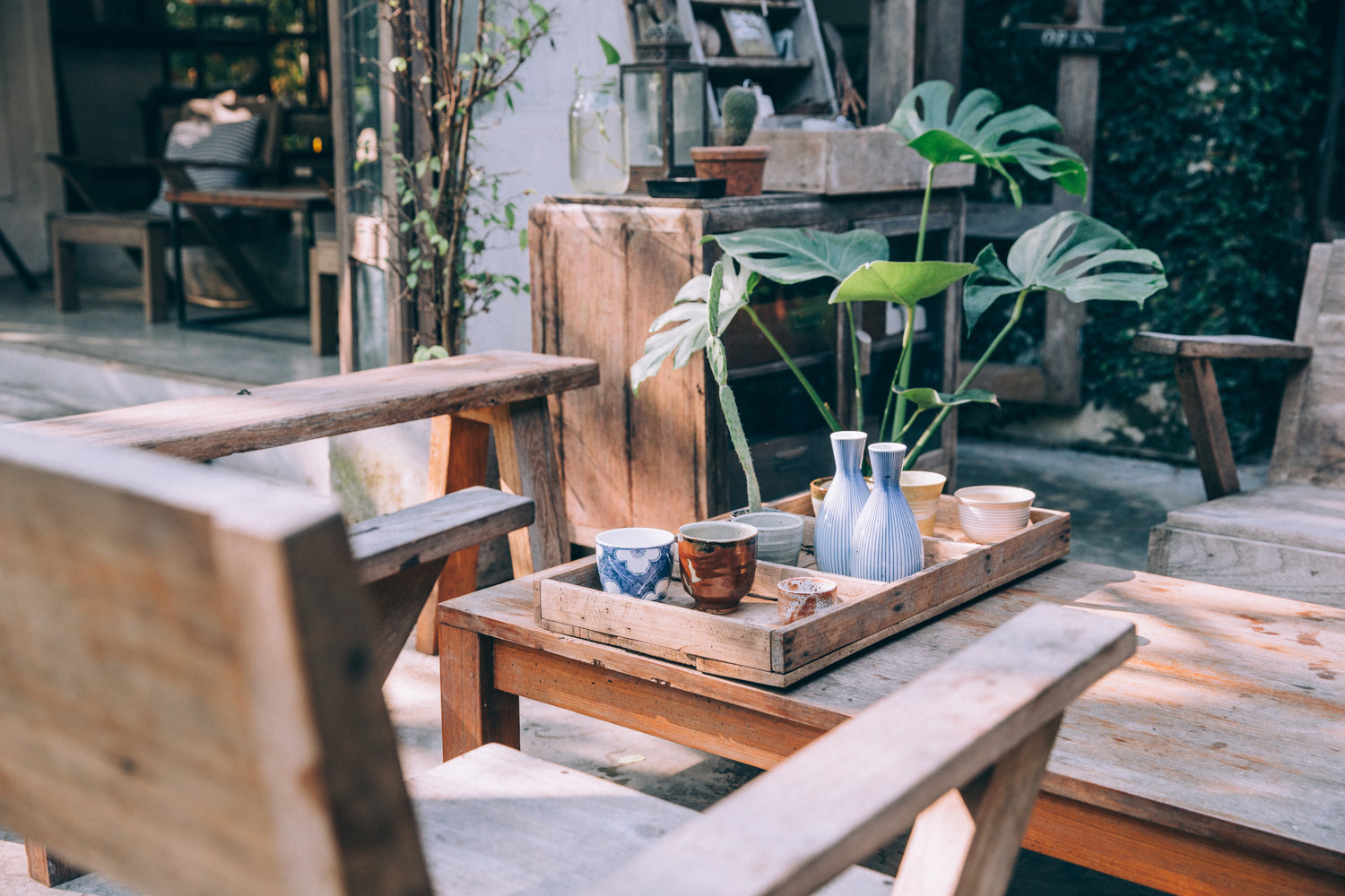 A cozy outdoor patio with salvaged wood furnishings